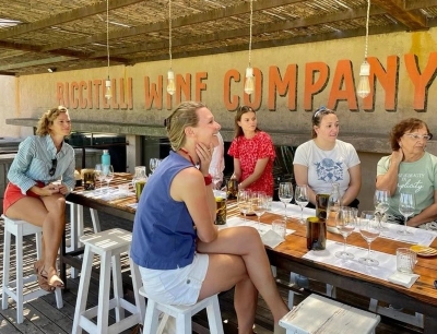Clients enjoying one of the many tastings and tours in Mendoza.