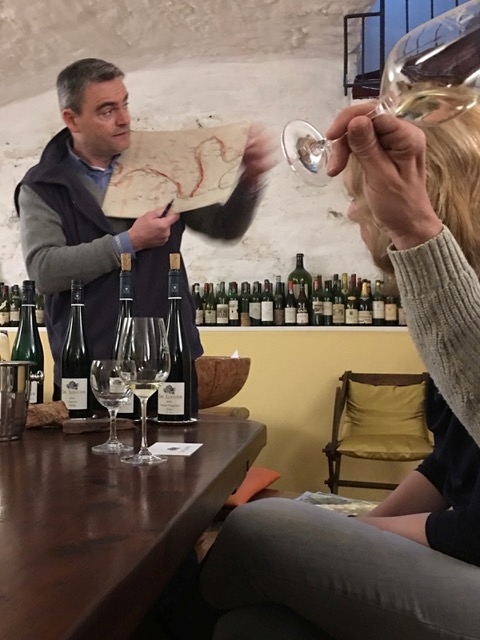 Clients enjoying explanations of terroir and geography from German winemakers.